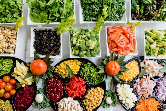 Beautiful whole food spread with colorful produce and ingredients